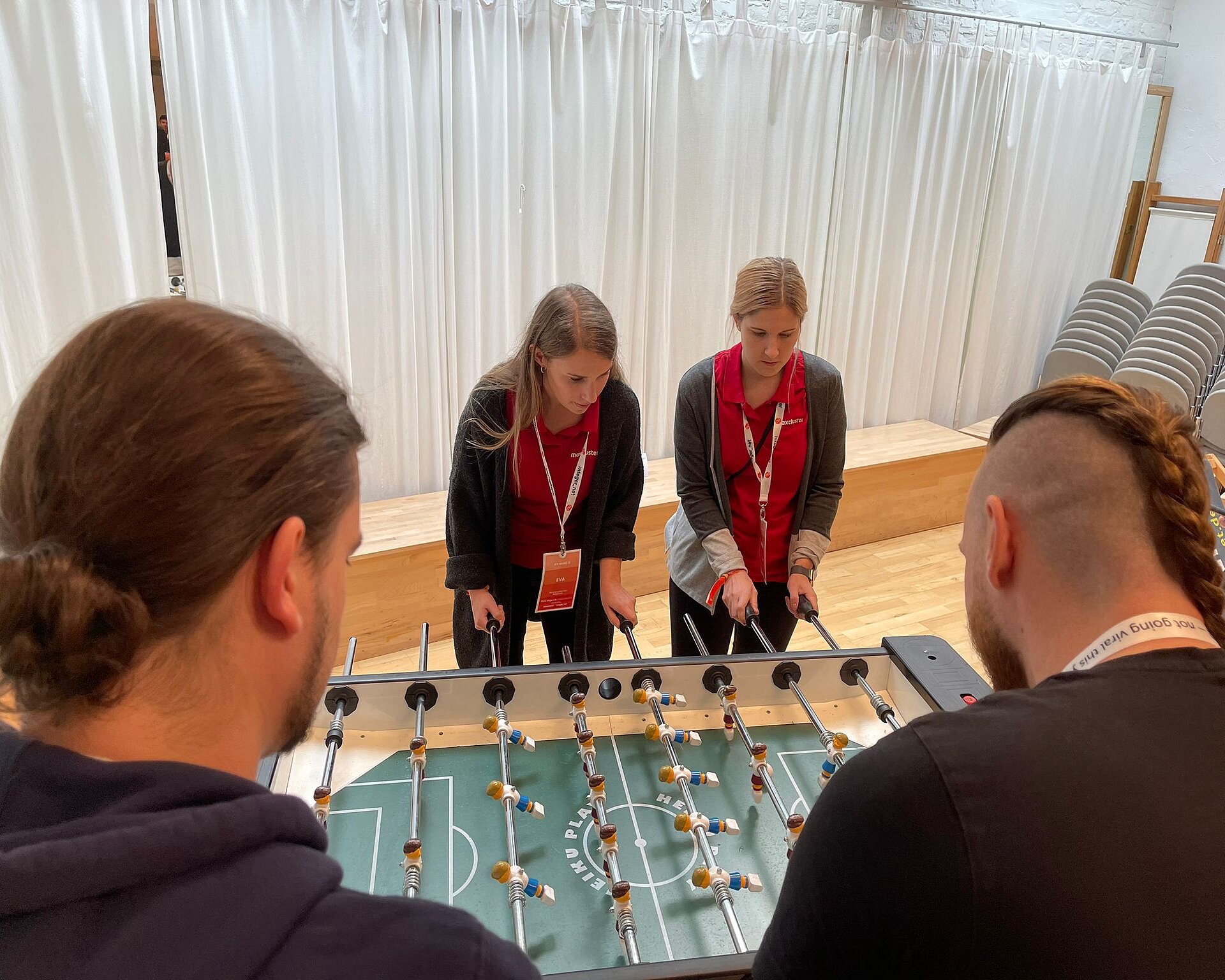 Passing time at the foosball table.