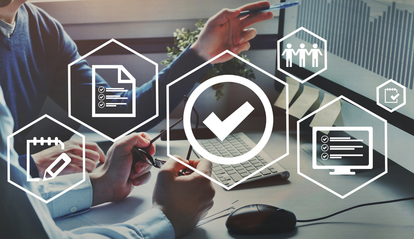 Hands work with digital documents and checklists to plan security measures